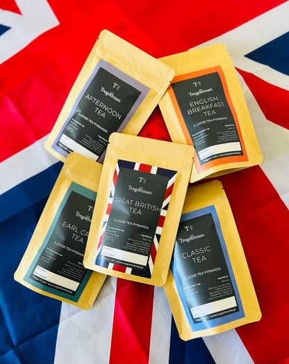Range of Tregothnan tea varieties in branded packaging displayed on a Union Jack flag